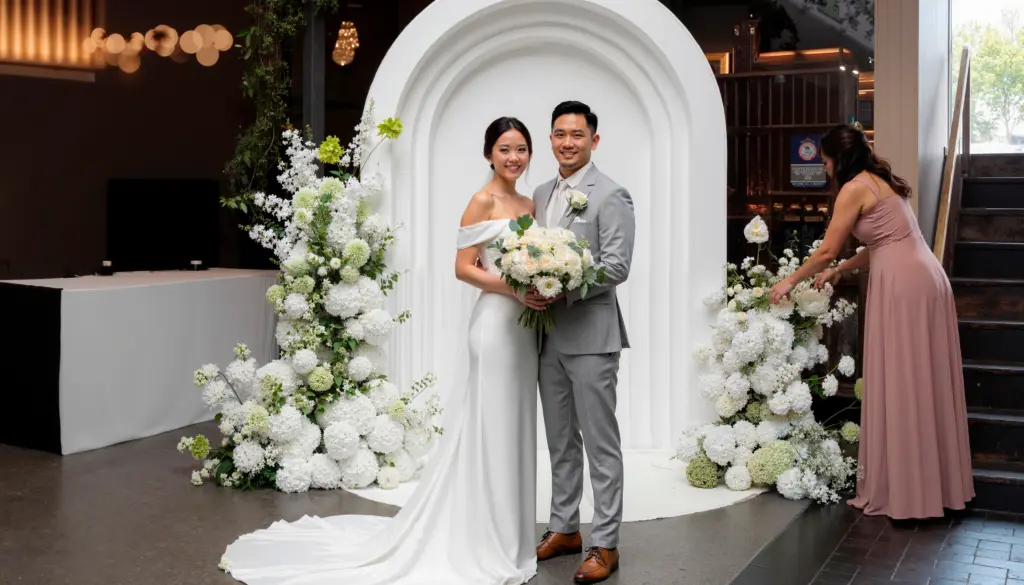 white colonnade wedding arch